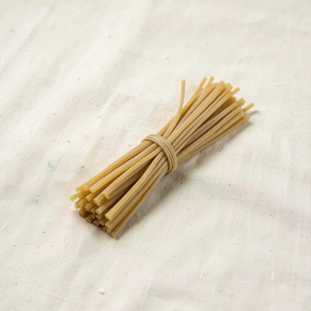 Fedelini, uncooked, on linen