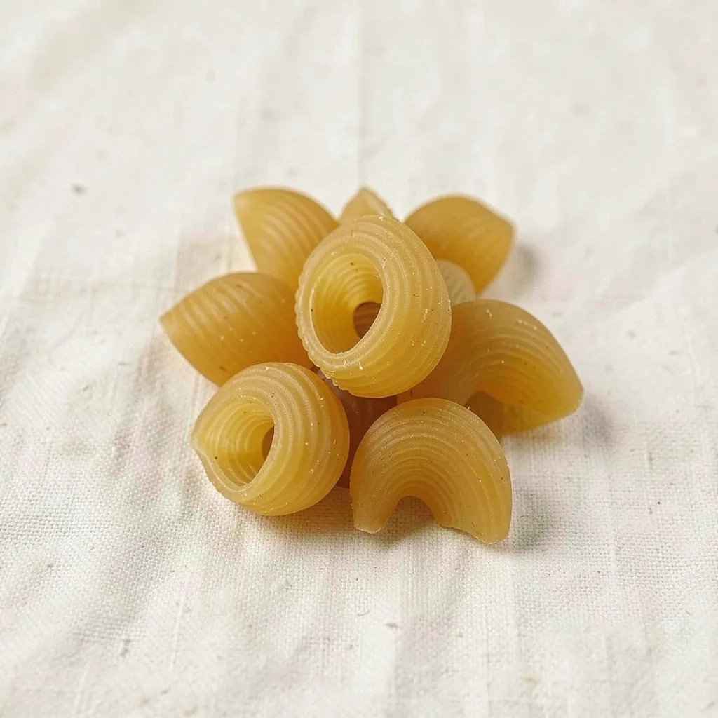 Pipe rigate, uncooked, on linen